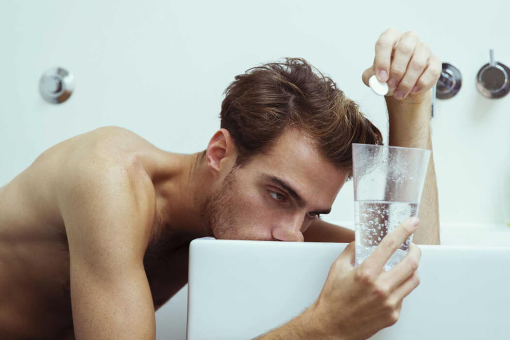 A man sick from his hangover - learn how IV therapy in Buckhead, GA can help with Vida-Flo.