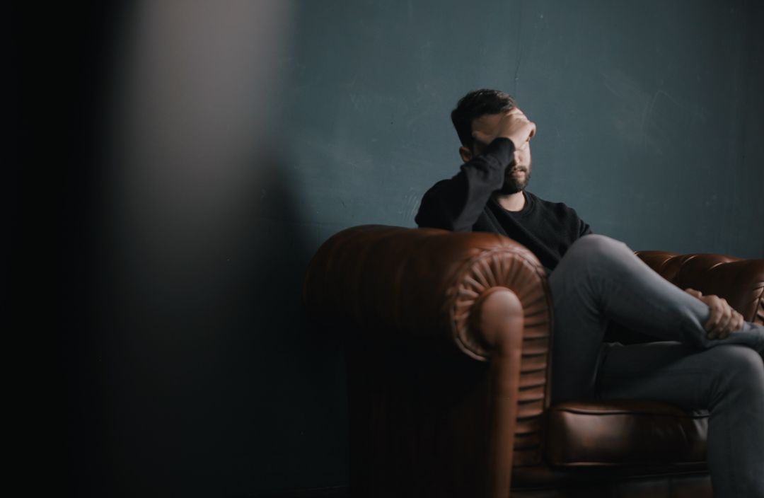 A man suffering from migraines - learn how Vida-Flo can help!