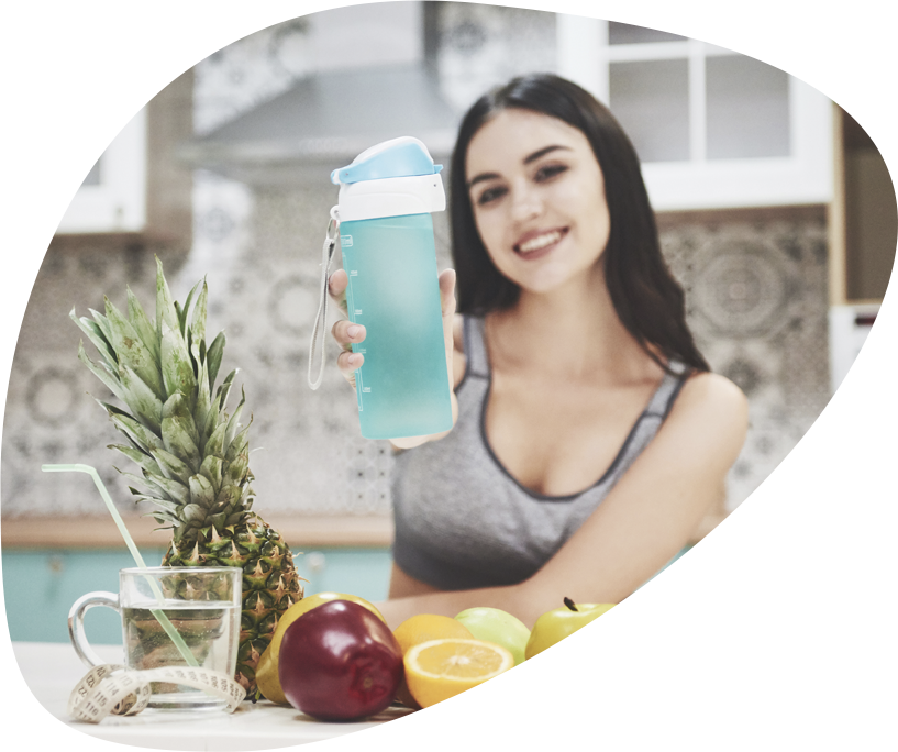 A woman with a water bottle - learn what NIH has to say about optimal hydration for humans in Buckhead, GA.