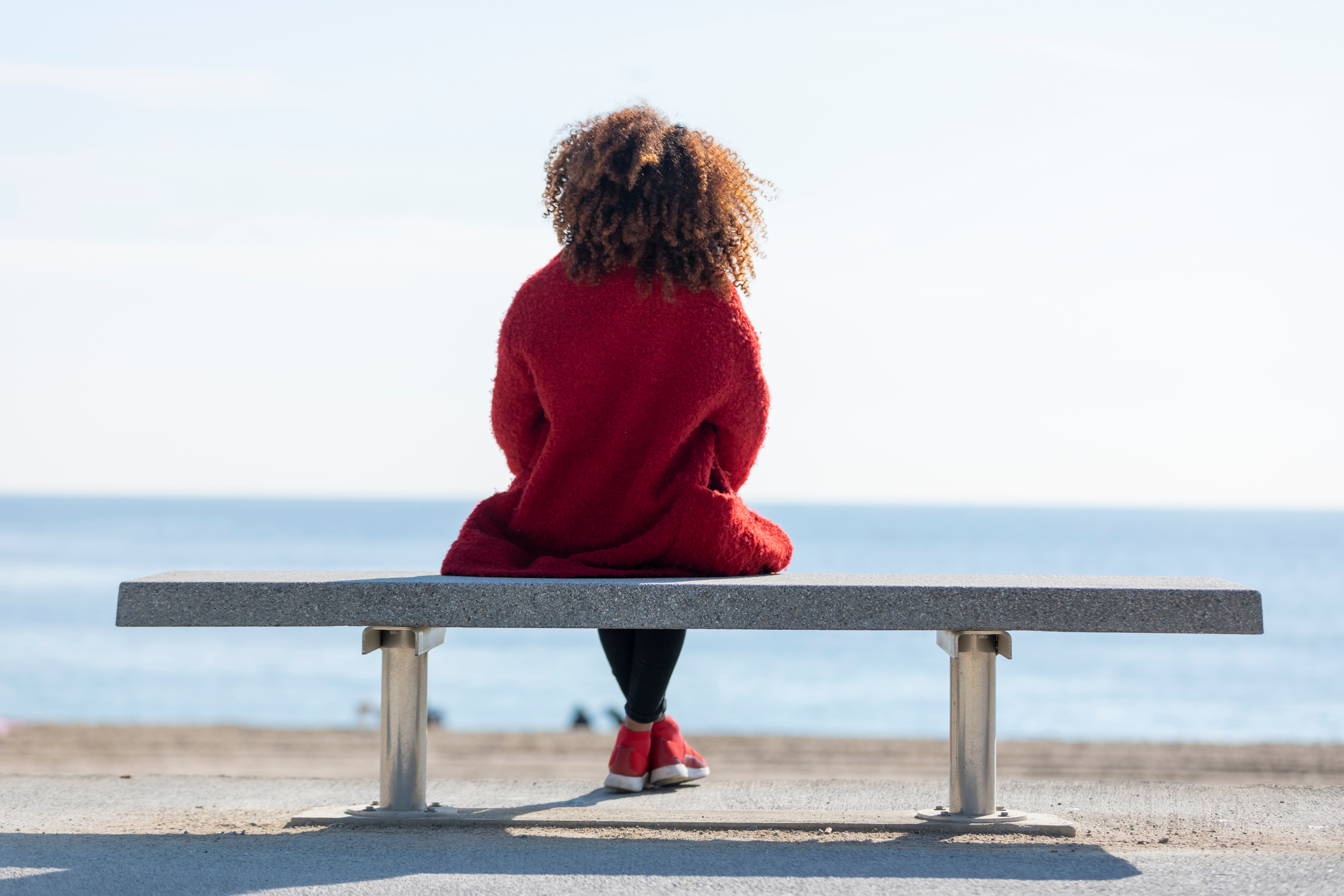 A woman sitting down outside - learn how Vida-Flo offer safe and effective mic iv infusion in Buckhead, GA.