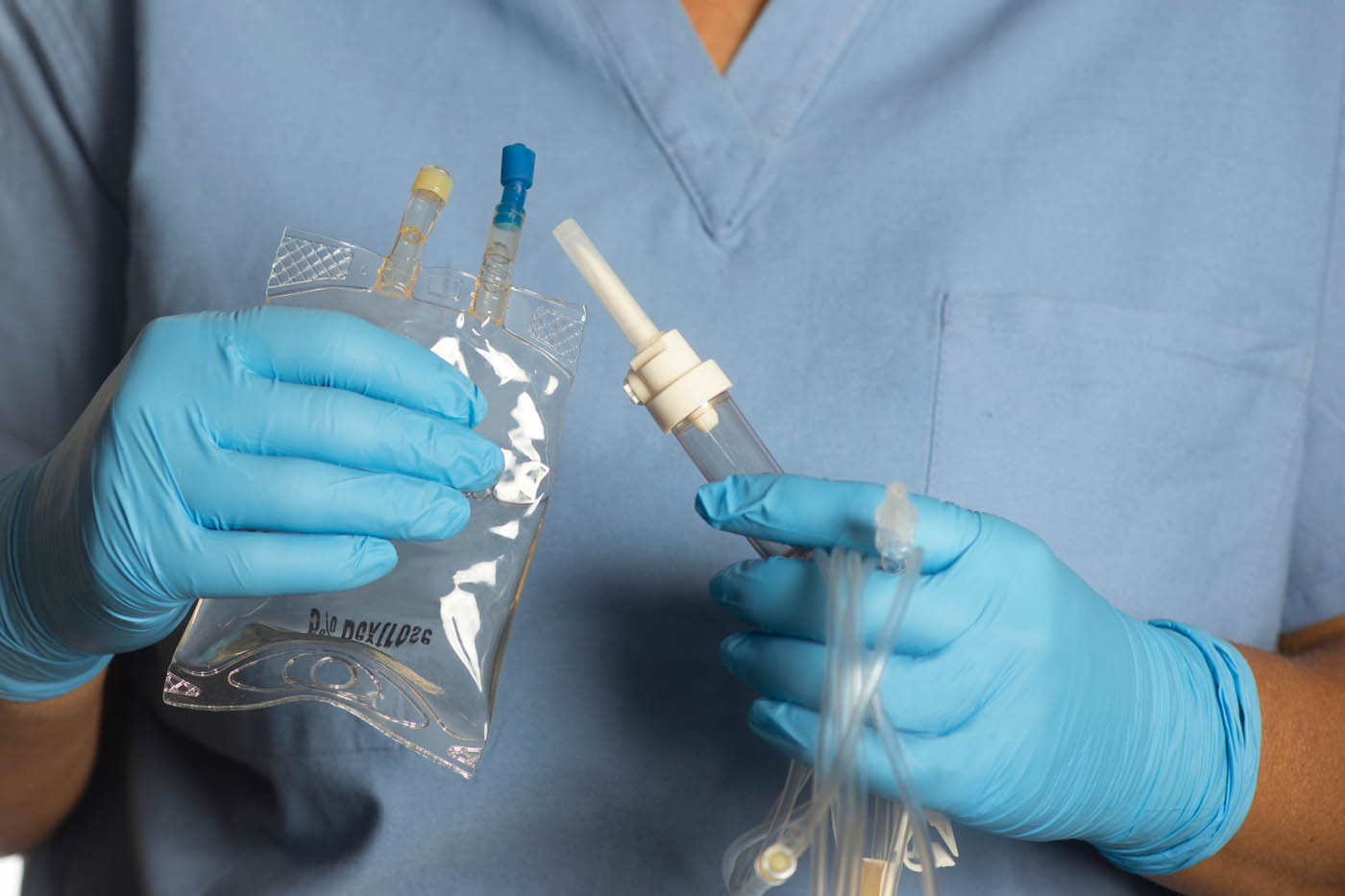 A person holding a drip bag - learn how Vida-Flo can help you manage gout pain.
