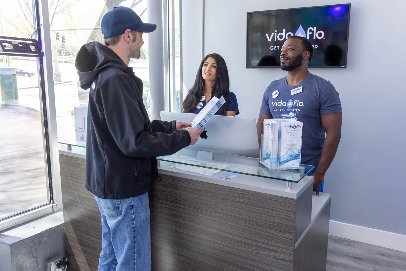 A Vida-Flo Buckhead, GA client reading testimonials.