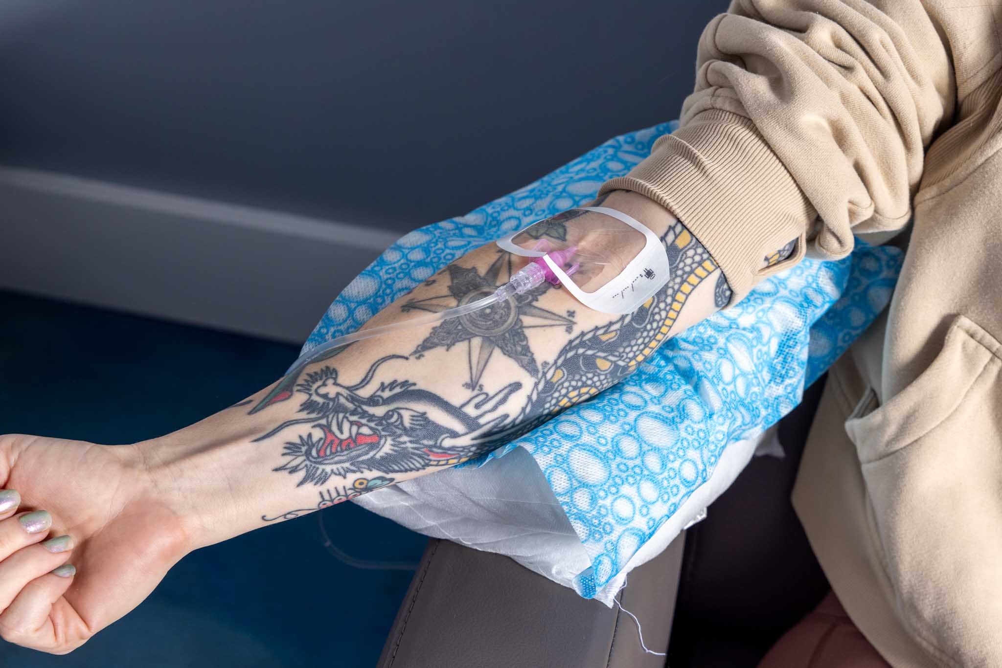A Vida-Flo Buckhead Registered Nurse administering IV fluids to a patient.